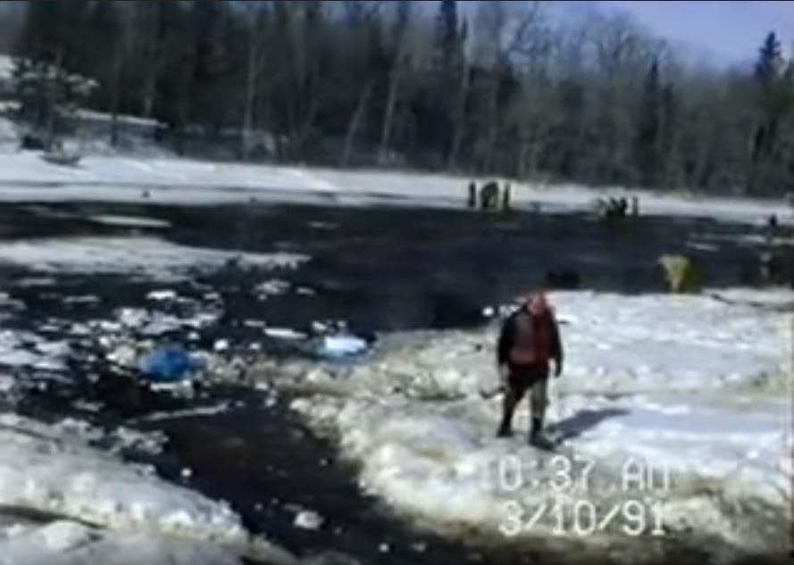 An image illustrating the environmental impact of the oil spill, with oil-contaminated water and affected vegetation. Source Reference: Marohn, K. (2021, March 3). 30 years later, echoes of largest inland oil spill remain in Line 3 fight. MPR News. Retrieved from https://www.mprnews.org/story/2021/03/03/30-years-ago-grand-rapids-oil-spill
